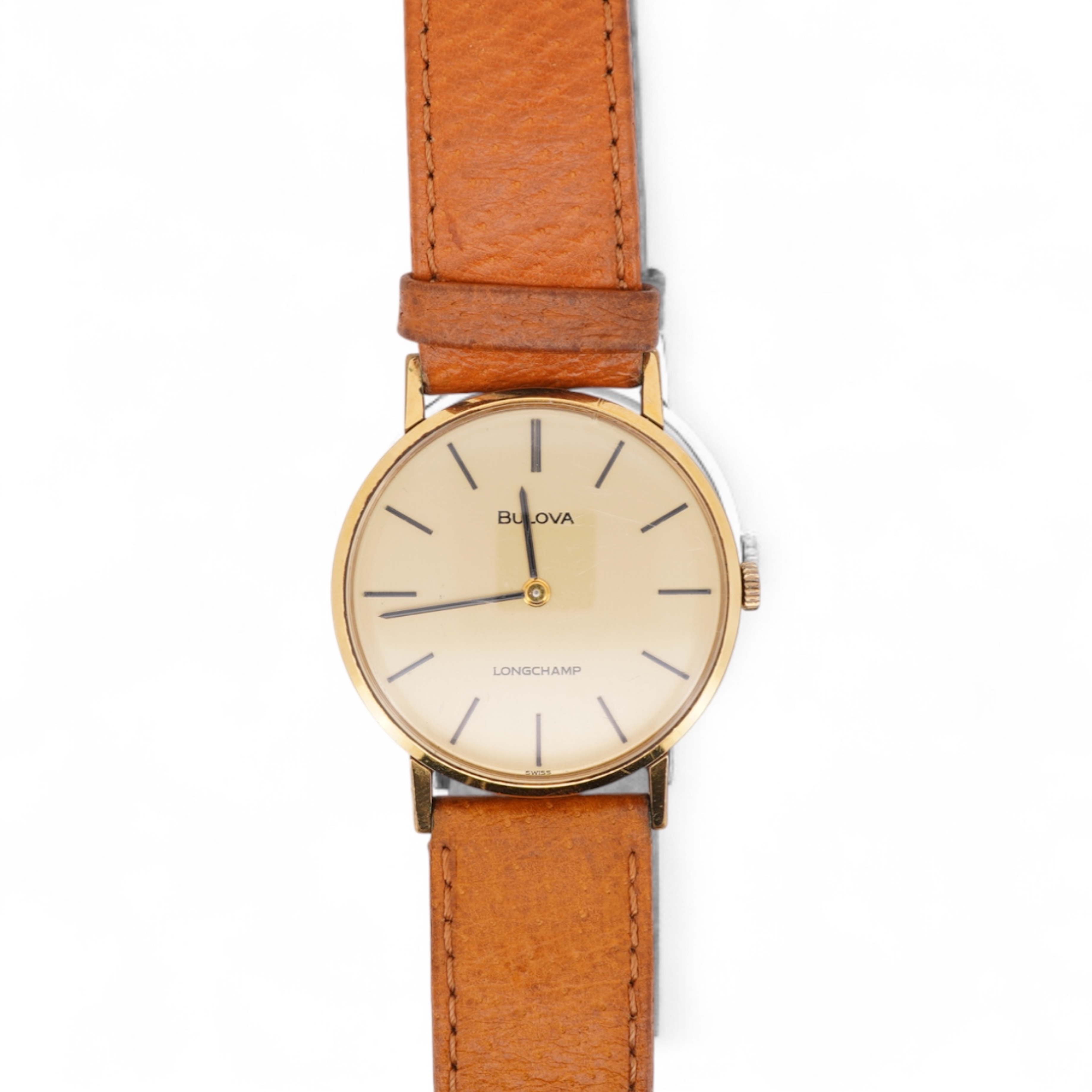 A gentleman's steel and gold plated Bulova Longchamp manual wind wrist watch, with baton numerals, case diameter 33mm, on a tanned leather strap.